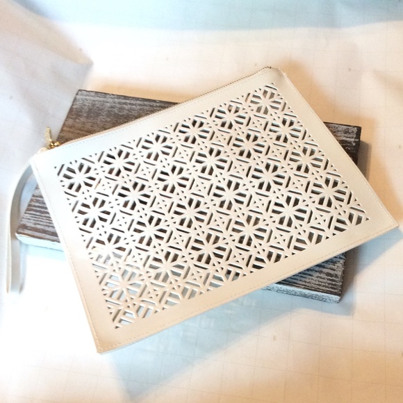 Tory Burch Handbags - Tory Burch White PVC Cutout Clutch/Wristlet